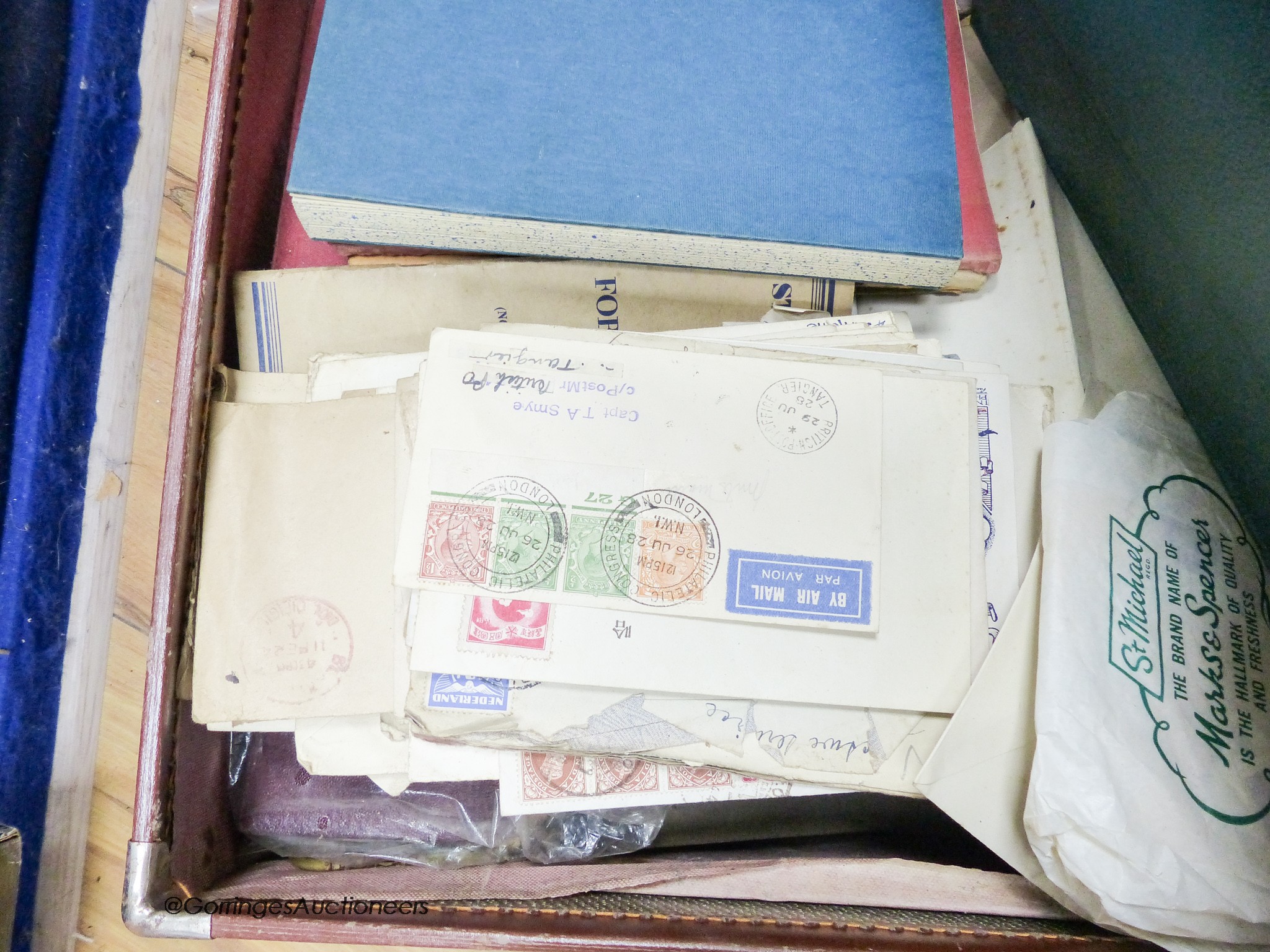A suitcase of mostly early world stamps in albums packets with a 1937 coronation, 1945 victory album leaves, loose packets, some postal covers (affected by damp)